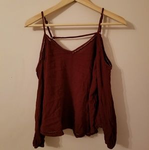 Open shoulder maroon top.